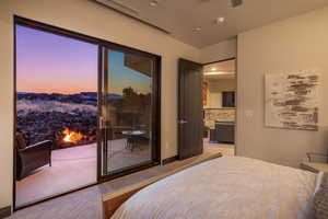 Bedroom featuring light colored carpet and ceiling fan