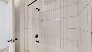 Bathroom featuring tiled shower / bath