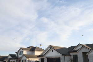 View of front of home featuring a garage