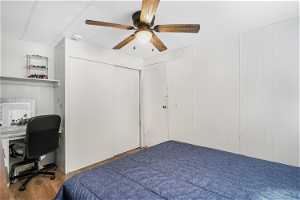 Bedroom with light wood-type flooring, a closet, and ceiling fan