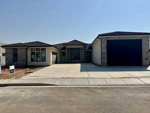 View of front of home featuring a garage