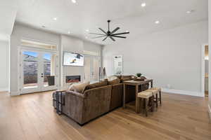 Living area featuring recessed lighting, a wealth of natural light, and light wood finished floors