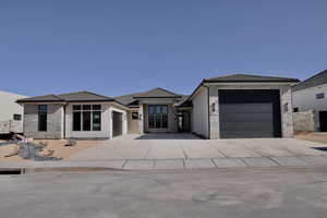 Prairie-style house featuring a garage