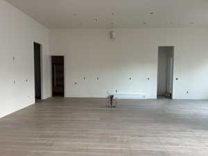 Unfurnished room with light wood-type flooring