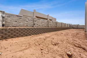 View of yard featuring fence