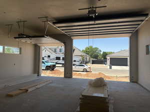 Garage with a carport and a garage door opener