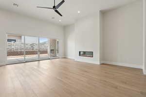 Unfurnished living room with ceiling fan, light wood-style floors, recessed lighting, baseboards, and visible vents