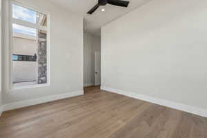 Spare room featuring light wood-style floors, baseboards, a ceiling fan, and recessed lighting