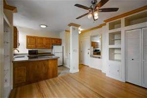 Entryway/Kitchen/Great Room with Hardwood Floors and Crown Moldings