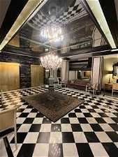 Main Lobby with Original Black/White MarbleTile Floors & Walls and Glass Chandelier