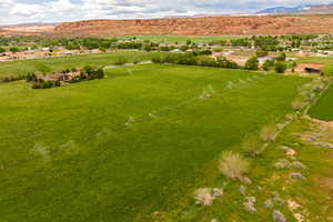 Aerial view featuring a rural view and a mountain view