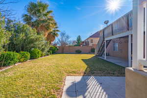 View of yard with a patio and central AC unit