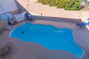 View of swimming pool featuring a patio