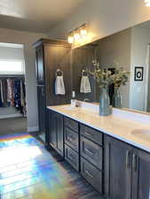 Bathroom featuring large vanity, hardwood / wood-style floors, and double sink