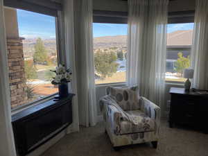 Sitting room with dark colored carpet