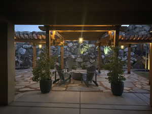 Patio terrace at twilight with a pergola