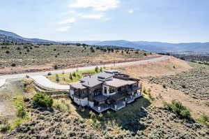 Birds eye view of property with a mountain view