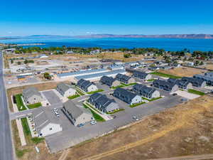 Drone / aerial view featuring a water and mountain view