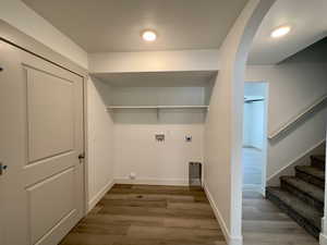 Laundry room with LVP flooring, ceiling fan, electric dryer hookup, and washer hookup