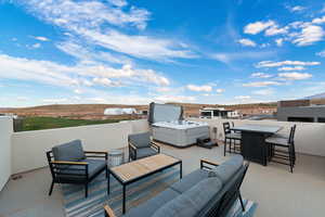 View of terrace featuring outdoor lounge area and a balcony