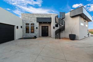 View of exterior entry featuring french doors