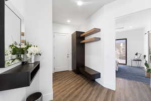 Entrance foyer featuring dark wood-type flooring