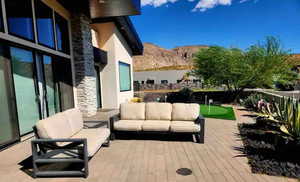 Exterior space featuring a mountain view and an outdoor living space