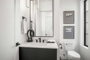 Bathroom with vanity and toilet