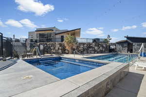 View of swimming pool with a patio