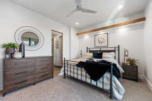 Bedroom featuring ceiling fan and light carpet