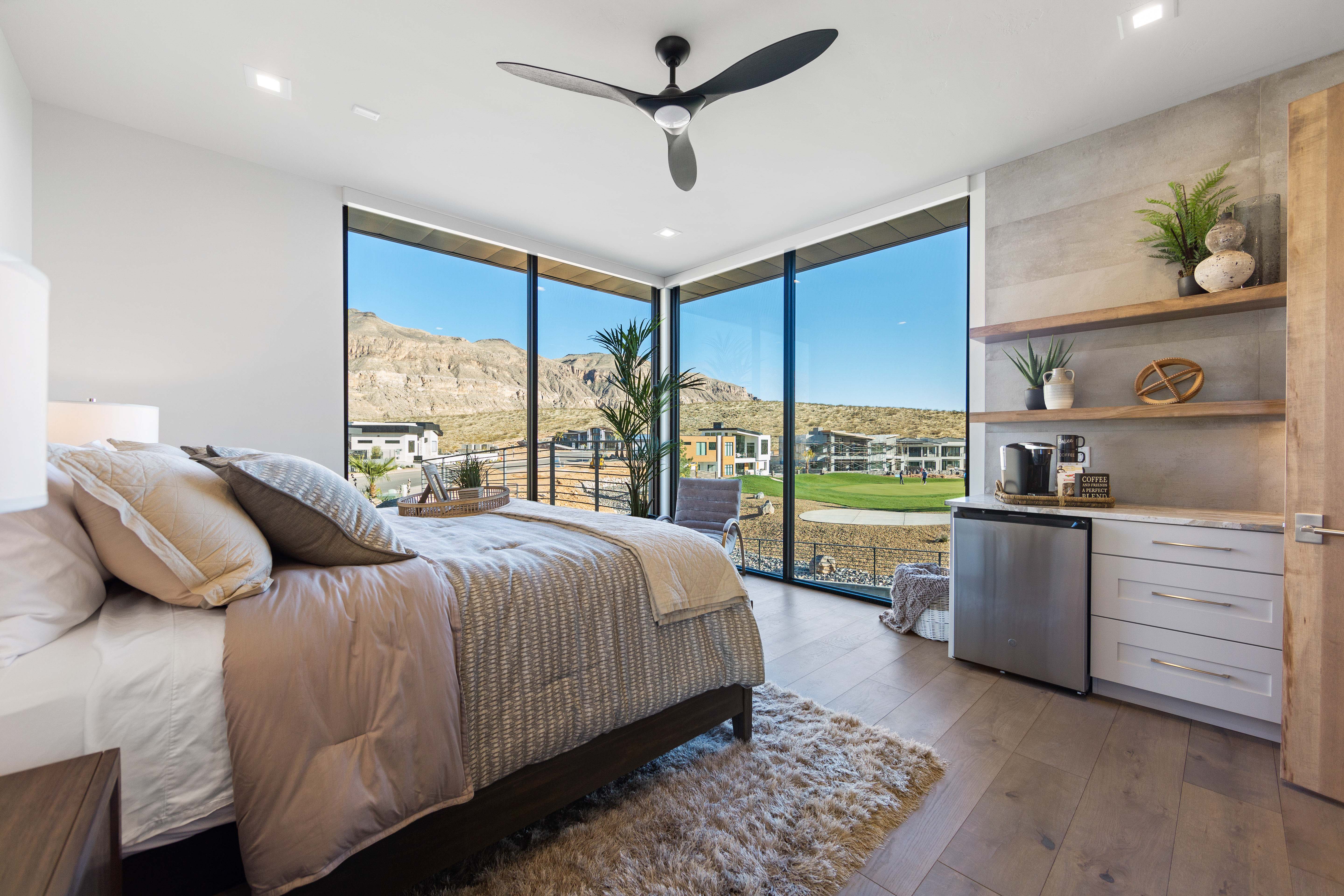 Bedroom with floor to ceiling windows, light hardwood / wood-style flooring, ceiling fan, access to exterior, and fridge