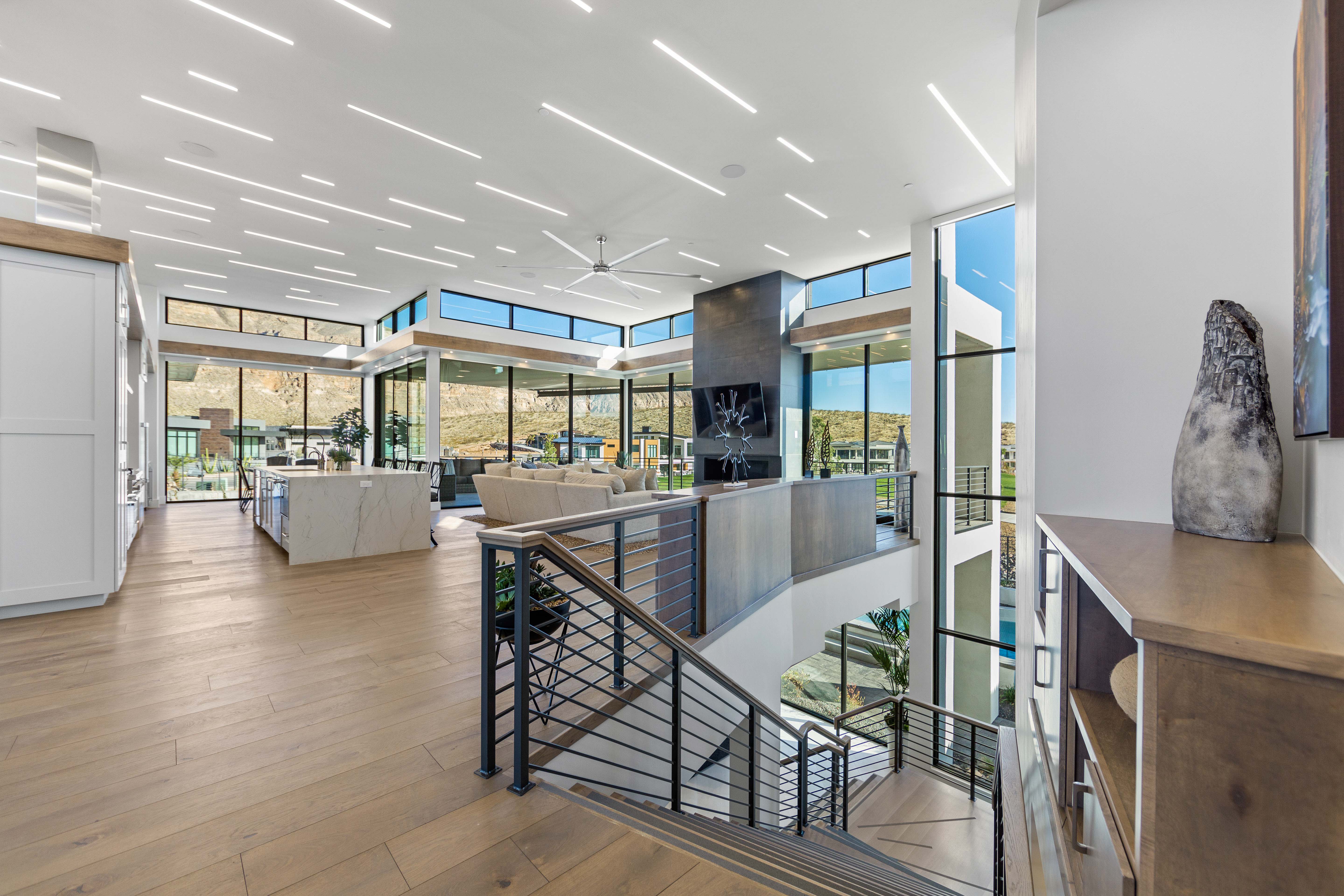 Corridor featuring floor to ceiling windows, light hardwood / wood-style flooring, and plenty of natural light