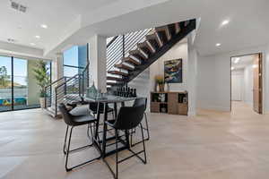 Dining room with light tile flooring