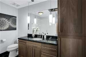 The bathroom offers ample storage space.