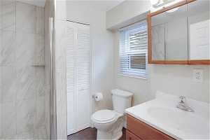 Basement Bathroom featuring vanity, tile flooring, with stunning new tile shower