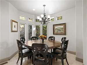 Dining room with light tile floors and plenty of natural light