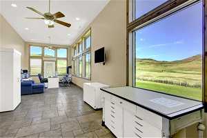 This sun room with large windows overlooking the backyard and north pasture is the perfect second office.