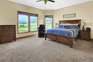 Master Bedroom with light carpet and ceiling fan