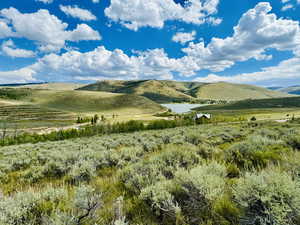 View of mountain feature with a water view and a rural view