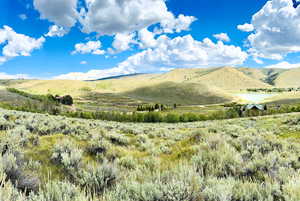 Property view of mountains with a rural view