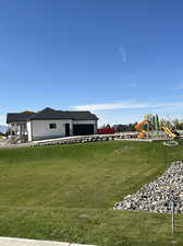 View of yard with a playground