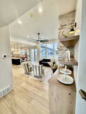 Living room featuring light hardwood / wood-style flooring and ceiling fan