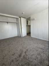 Unfurnished bedroom featuring a closet and carpet