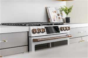 Interior details featuring white range with gas cooktop