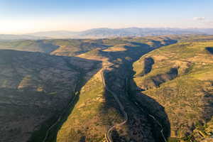 Aerial overview of property's location featuring mountains