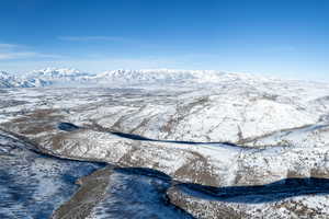 Snowy aerial view with a mountain view