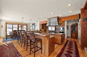 Gourmet kitchen with breakfast bar and separate dining space.