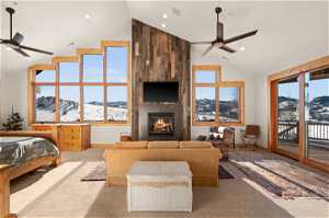 Primary Bedroom with expansive views, updated fireplace and sliding doors to private deck.