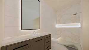Bathroom featuring vanity, toilet, tiled shower, tile walls, and tile flooring