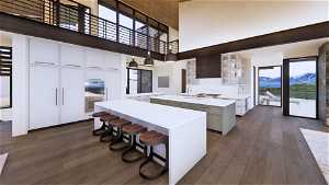 Kitchen with a mountain view, a kitchen island, and white cabinets